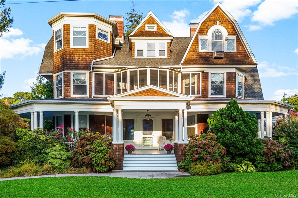 front view of house that has a yard