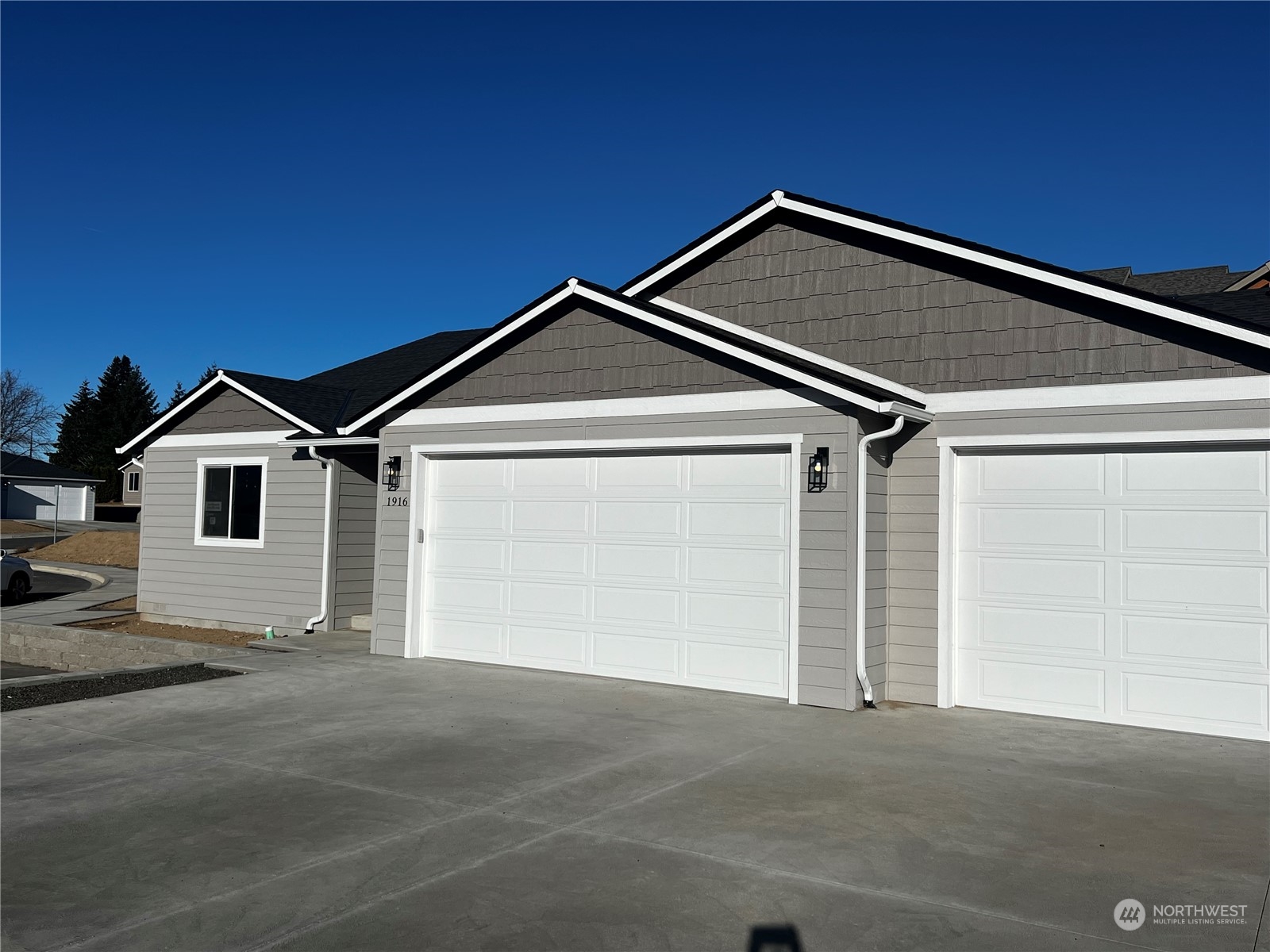 a view of garage and yard