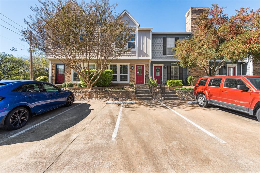 a front view of a house with parking area