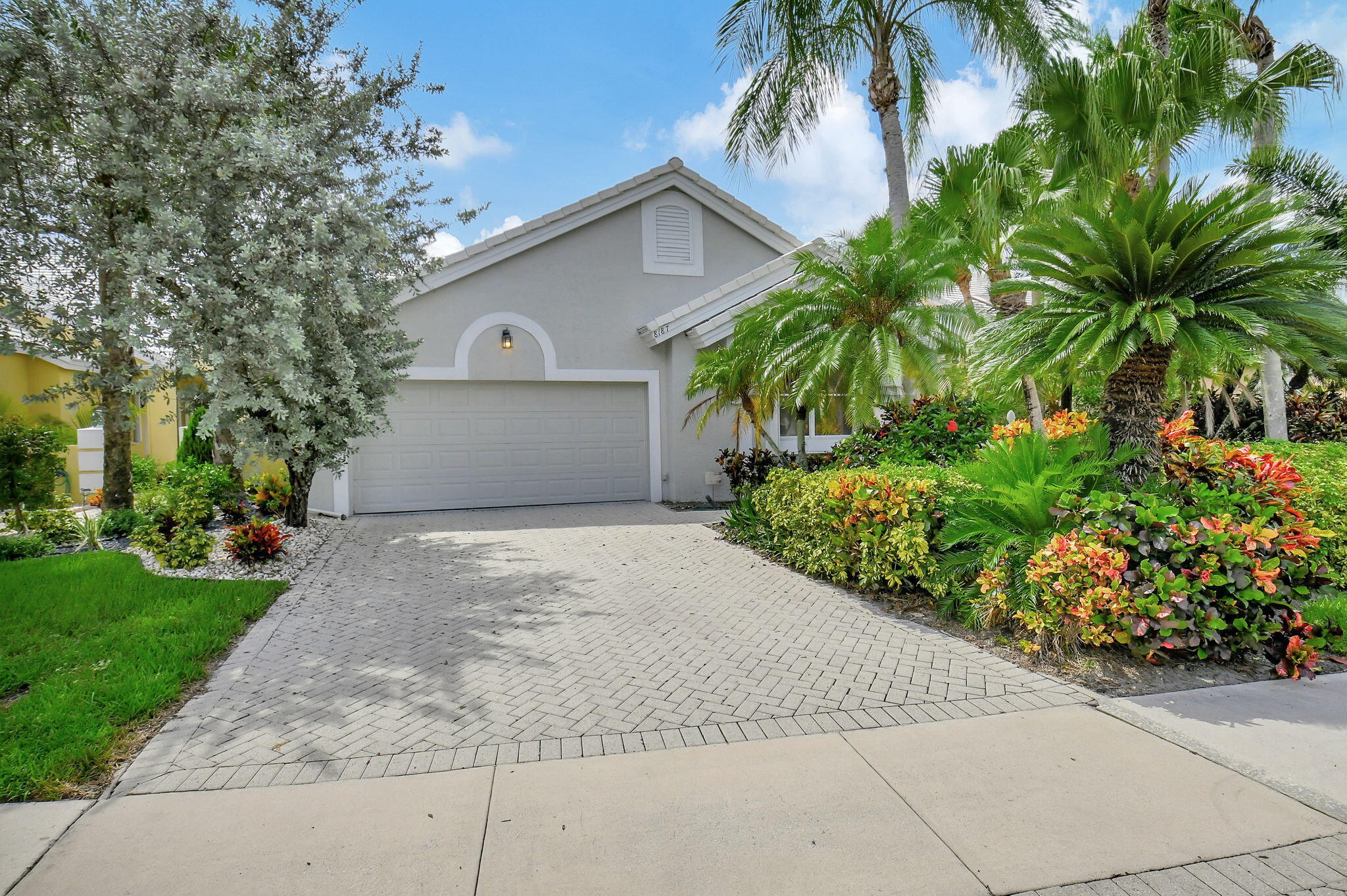 a front view of a house with garden