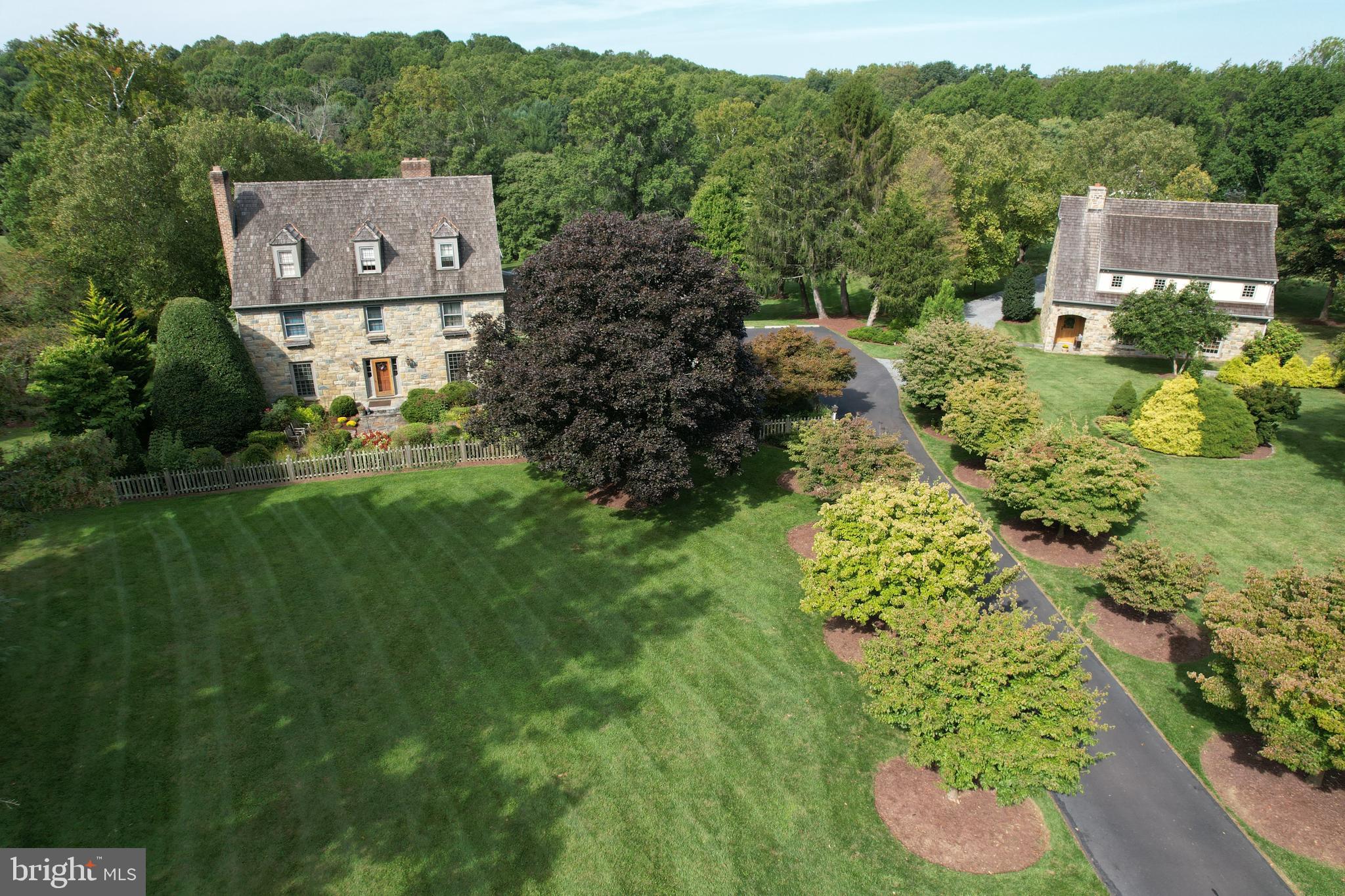 a aerial view of a house with a yard