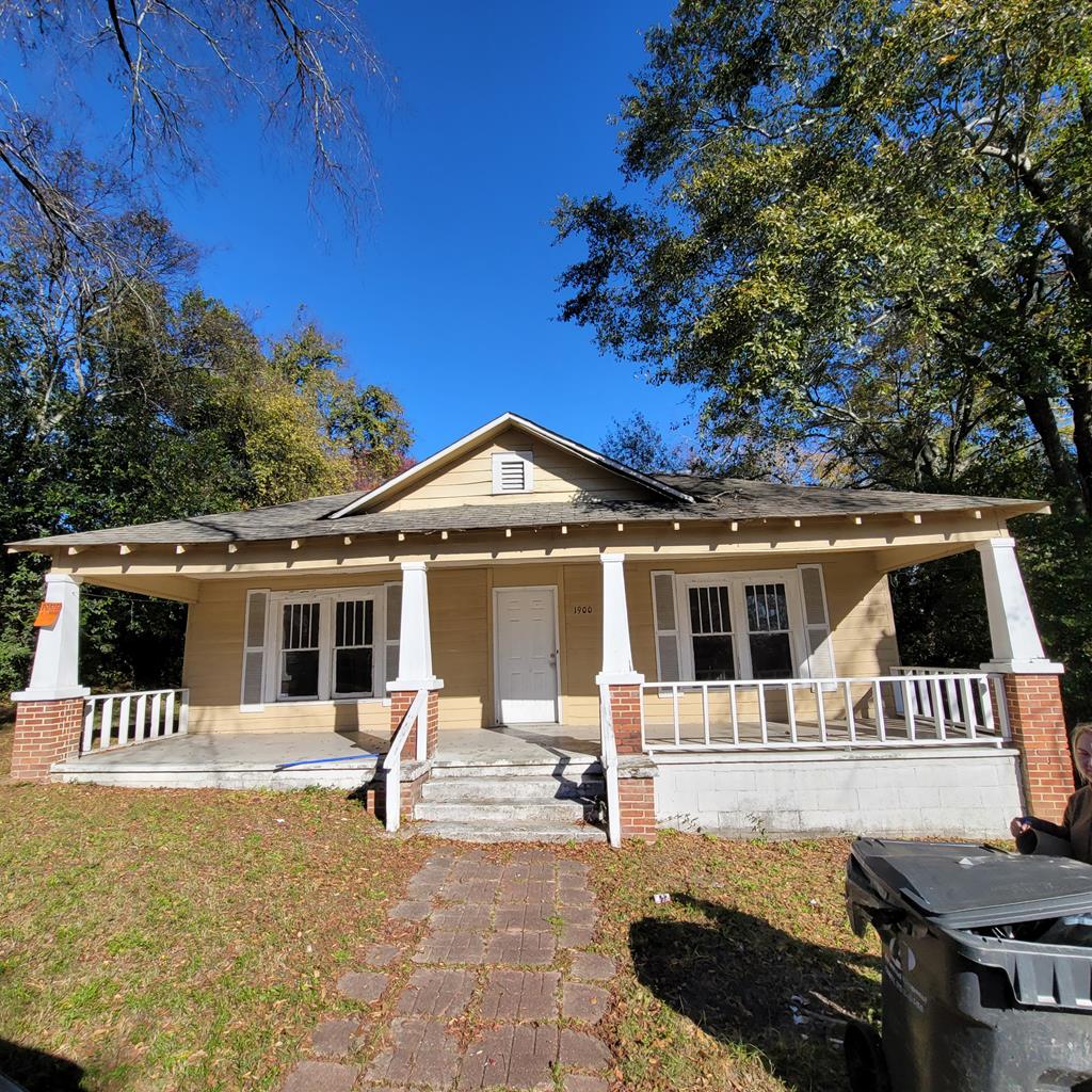 a front view of a house with a patio