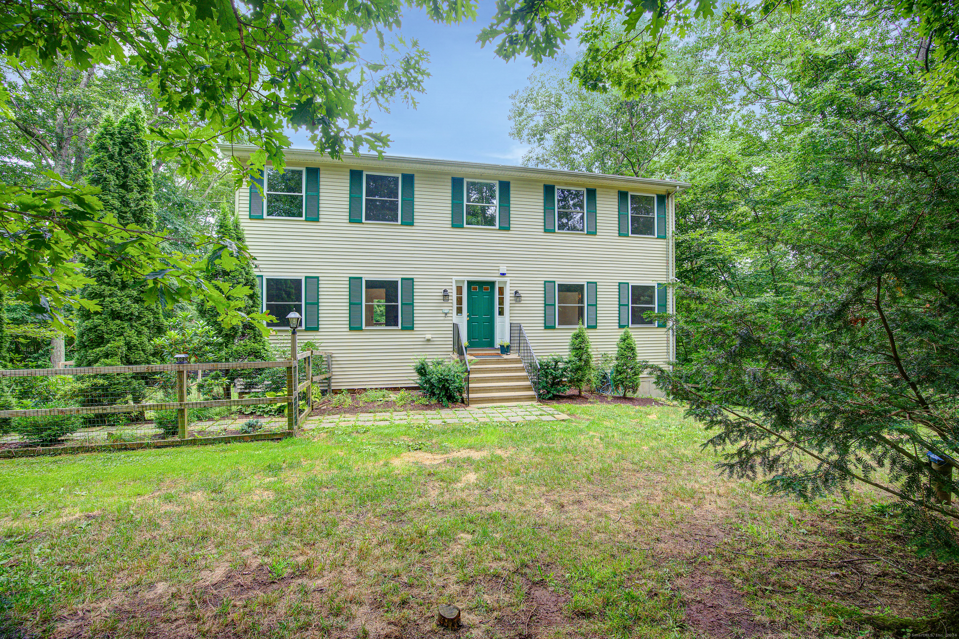 front view of a house with a yard