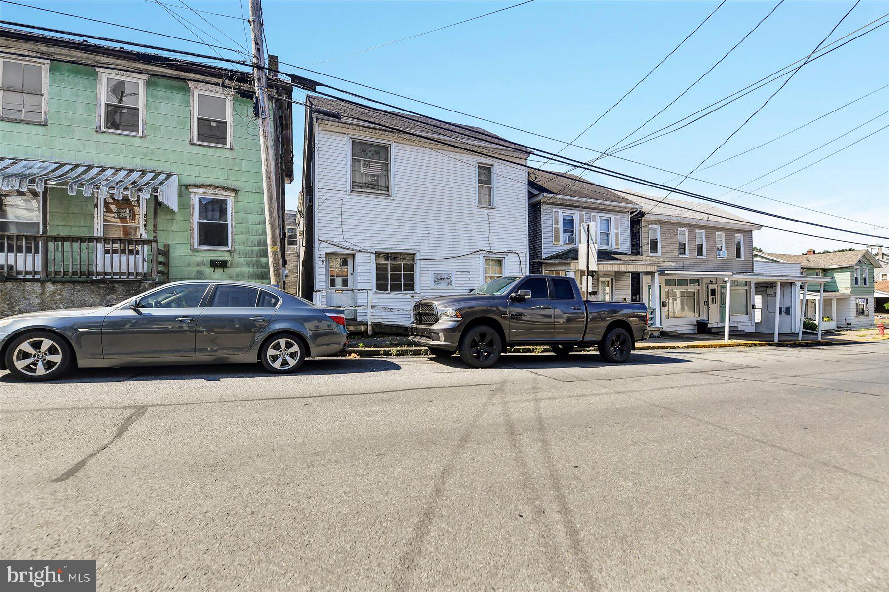 a view of a car parked in front of a building