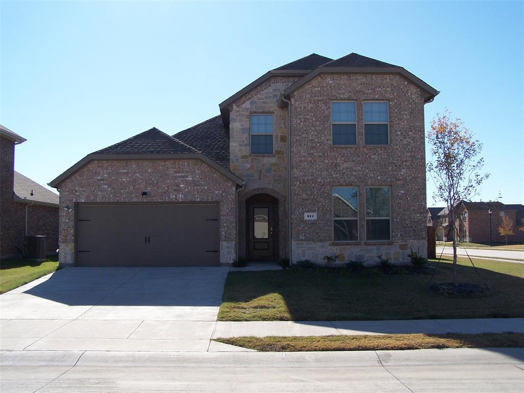 a front view of a house with yard