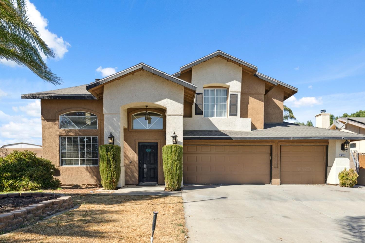 a front view of a house with yard