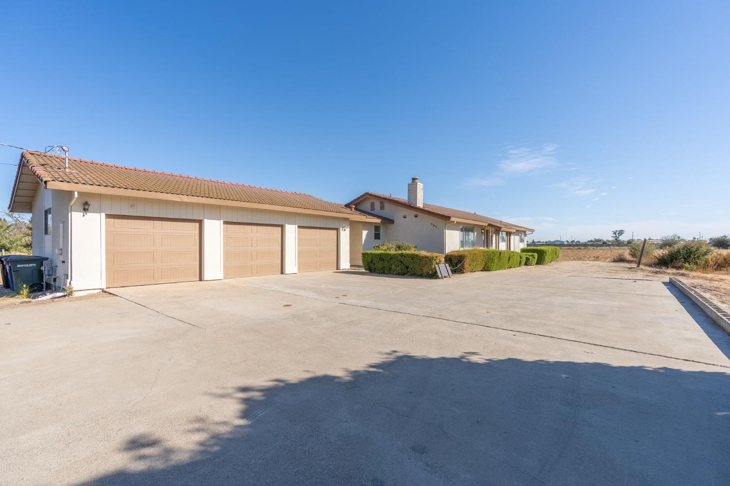 a view of a house with a road