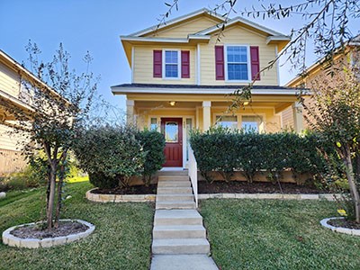 a front view of a house with a yard