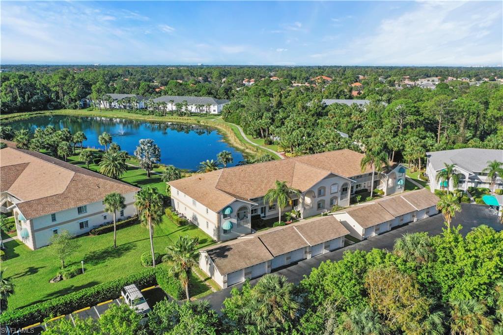 an aerial view of house with yard swimming pool and outdoor seating