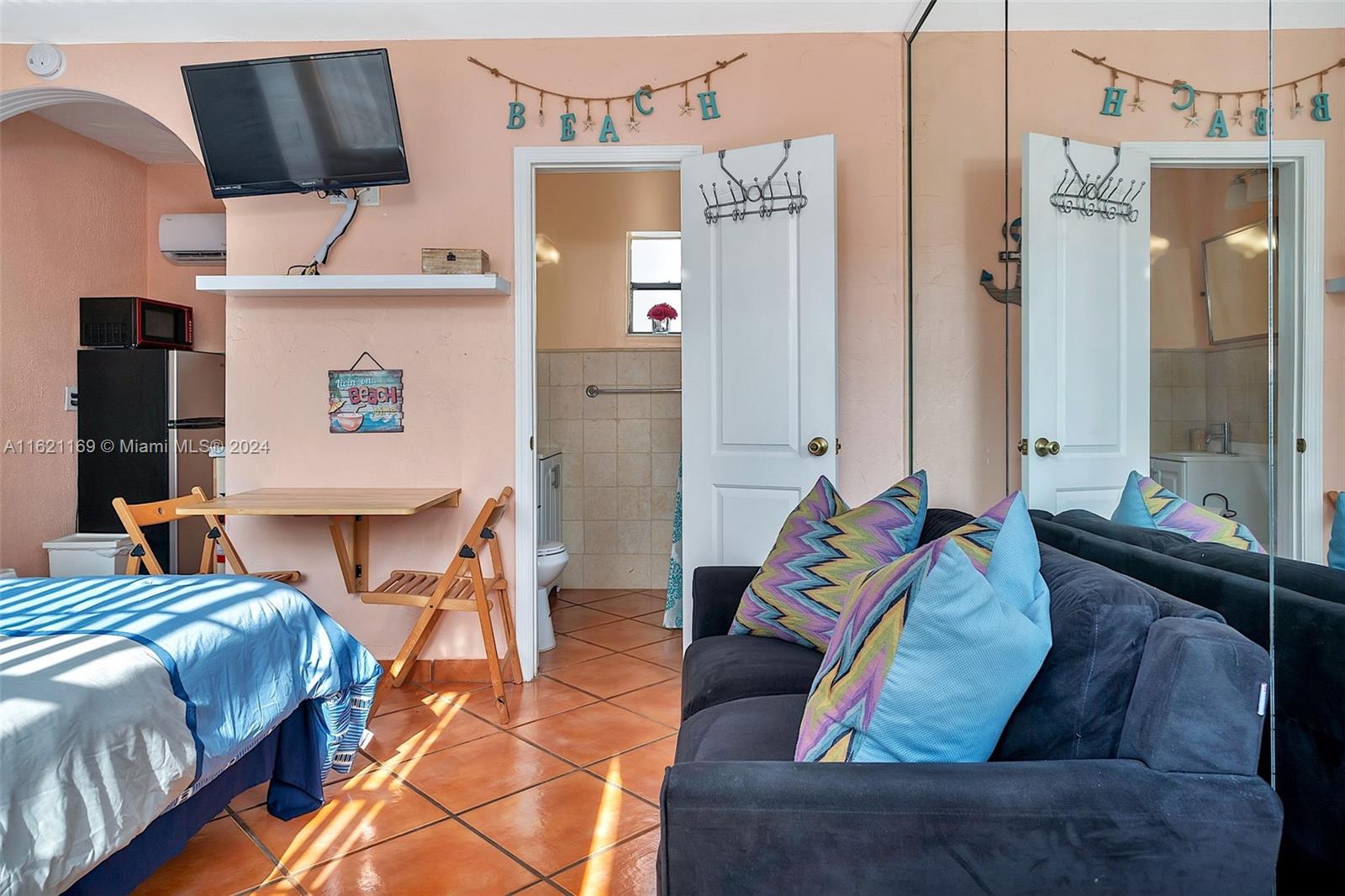 a living room with furniture and a flat screen tv