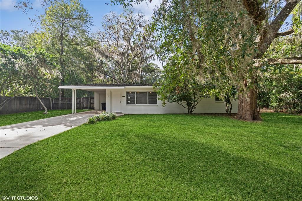 front view of a house with a yard