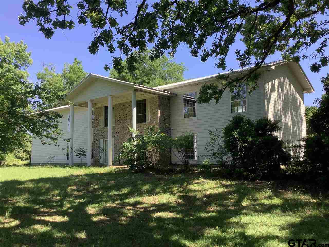 a view of a yard in front of house