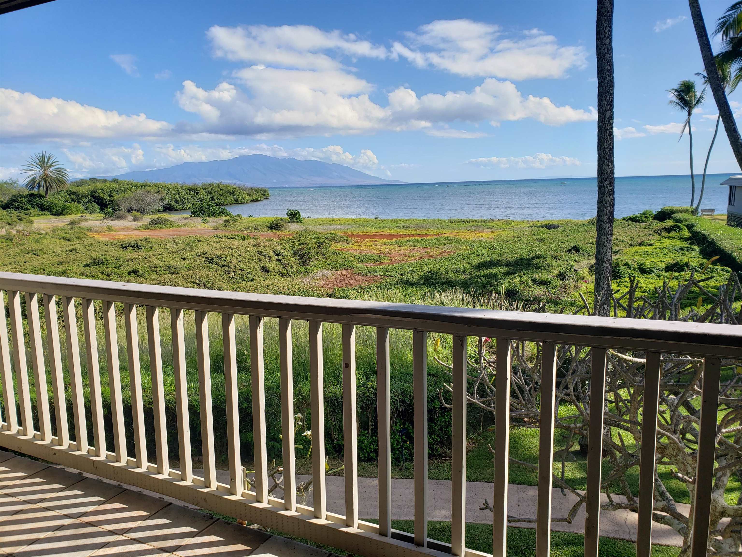 a view of a balcony with an ocean view