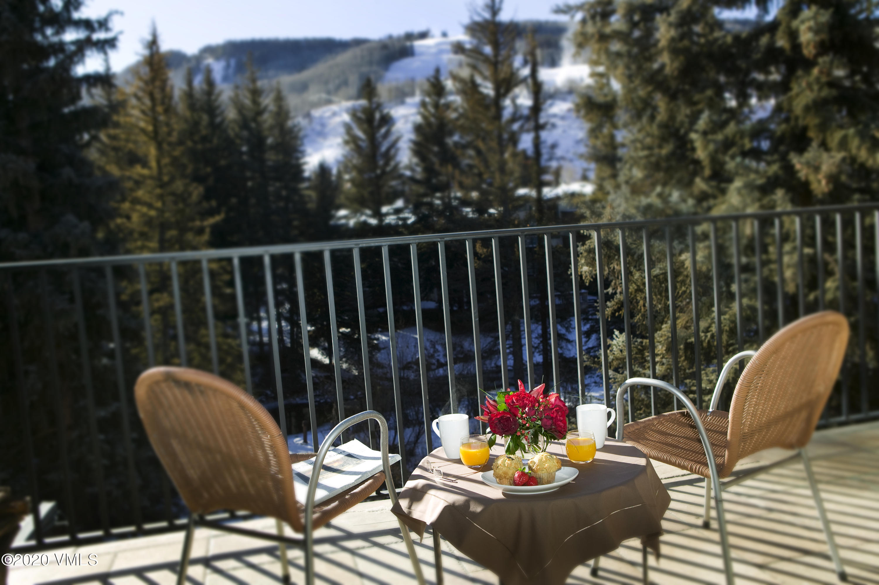 a view of a chairs and tables in the balcony