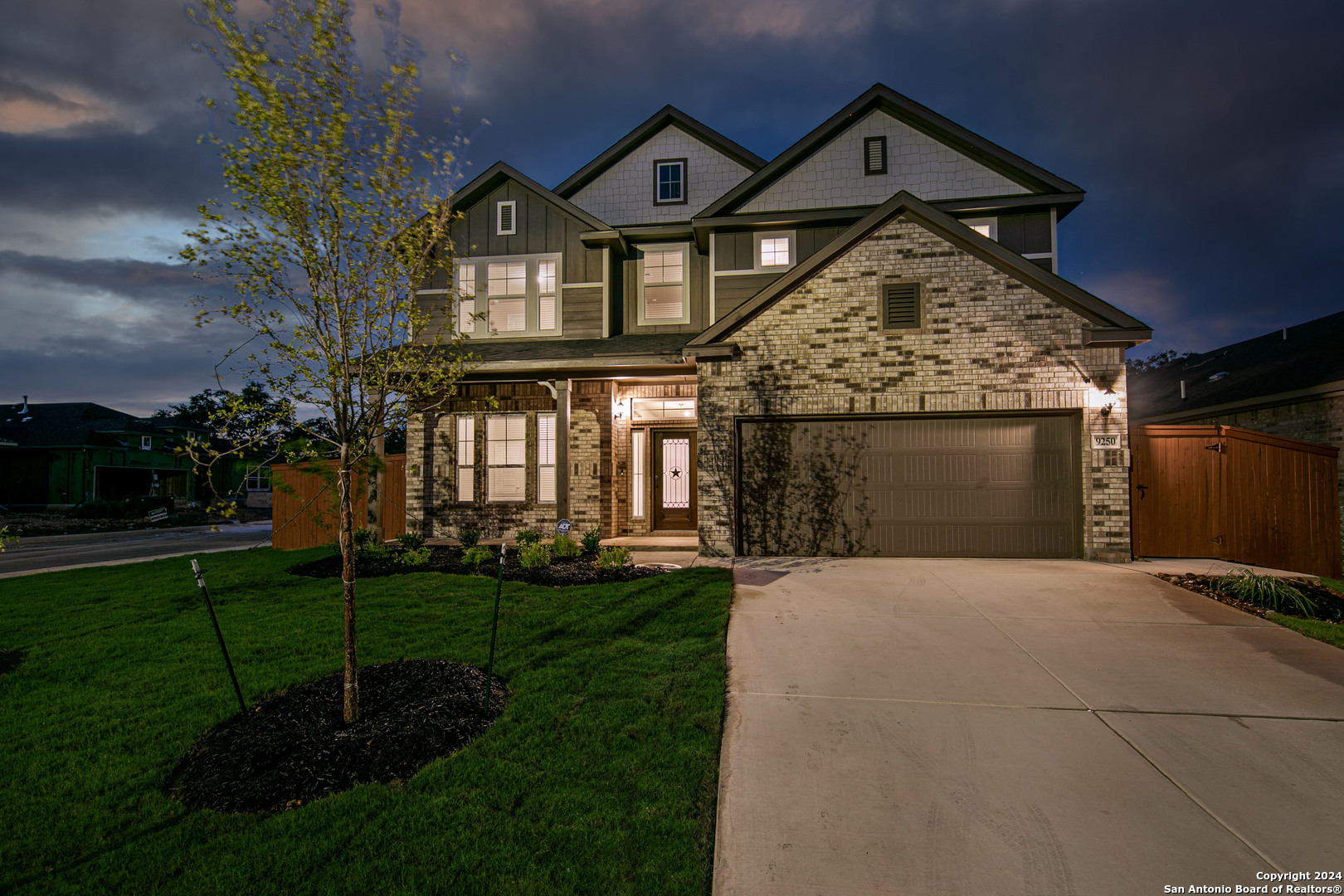 a front view of a house with a yard