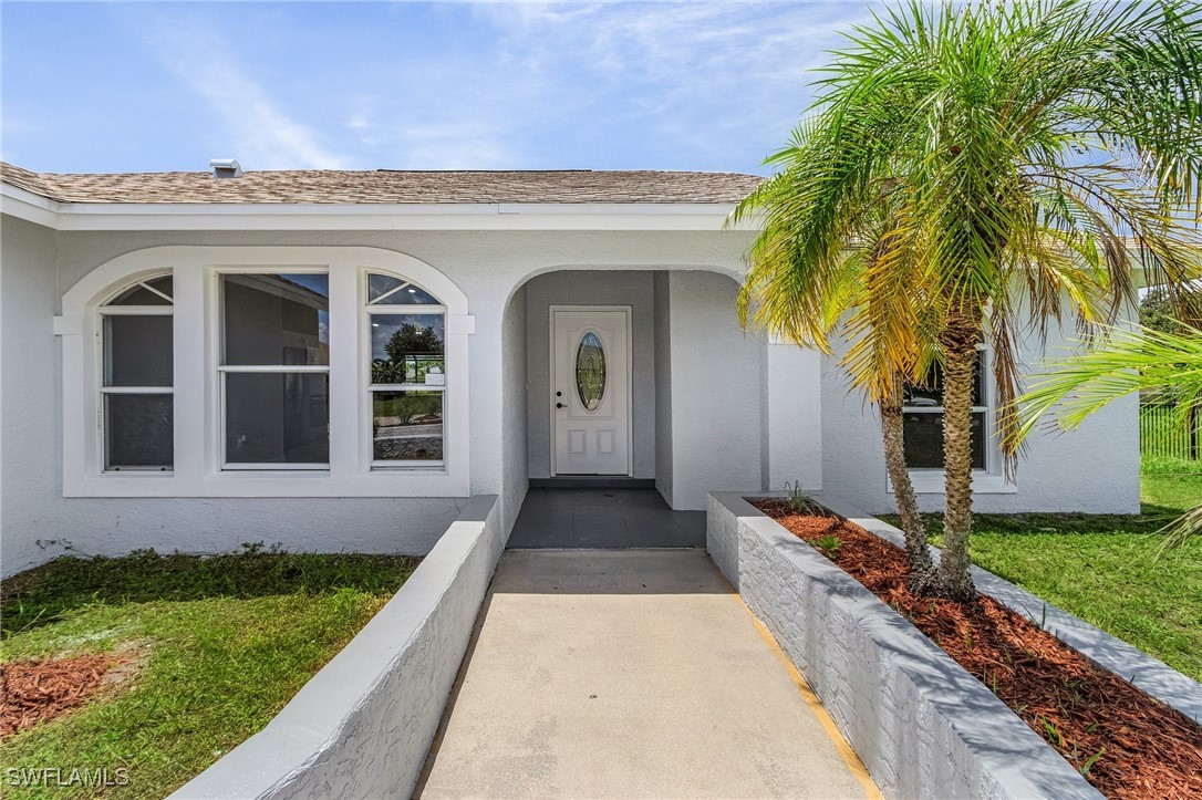 front view of a house with a yard