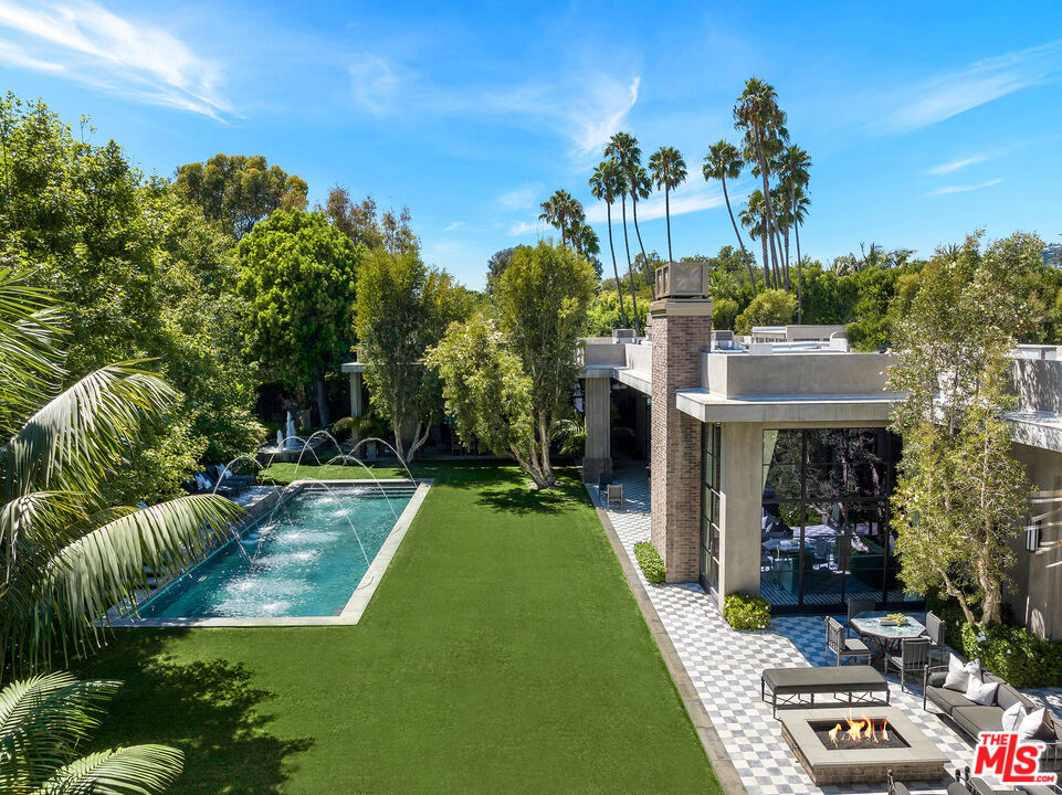 a view of a swimming pool with a patio