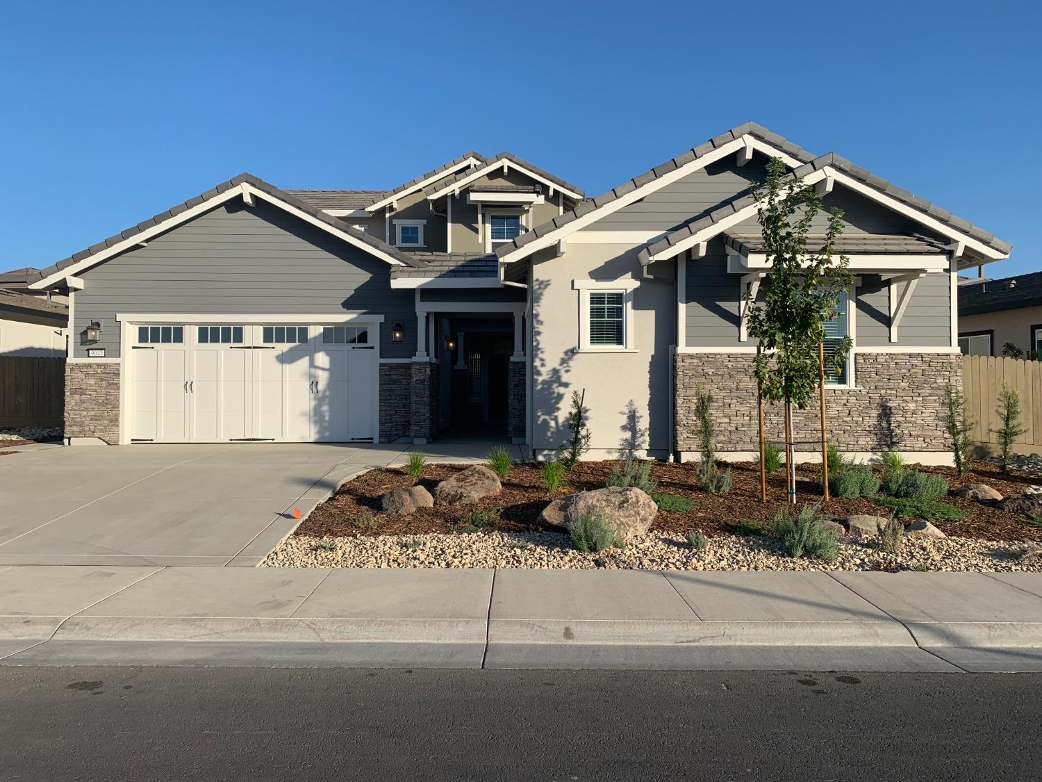 a front view of a house with garage