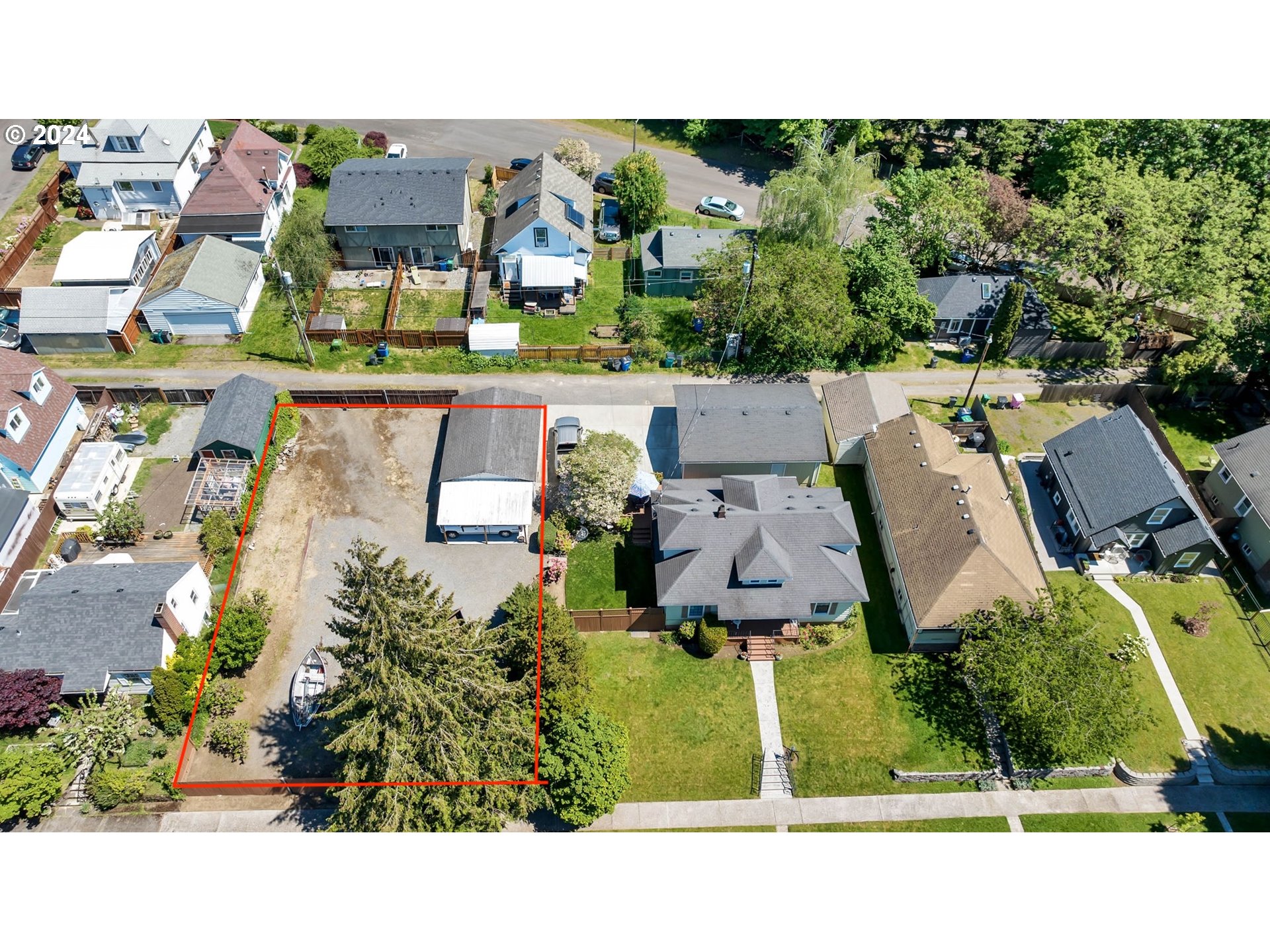 an aerial view of a house with a garden