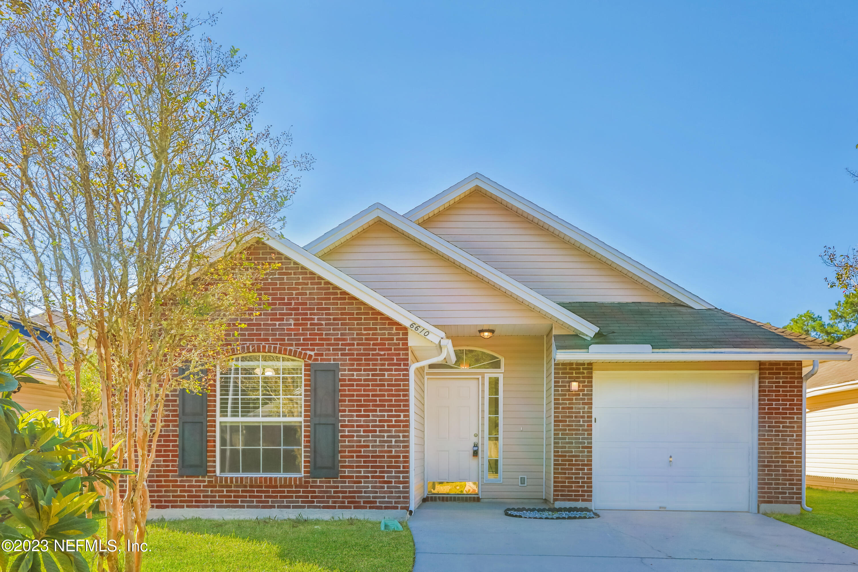 front view of a house with a yard