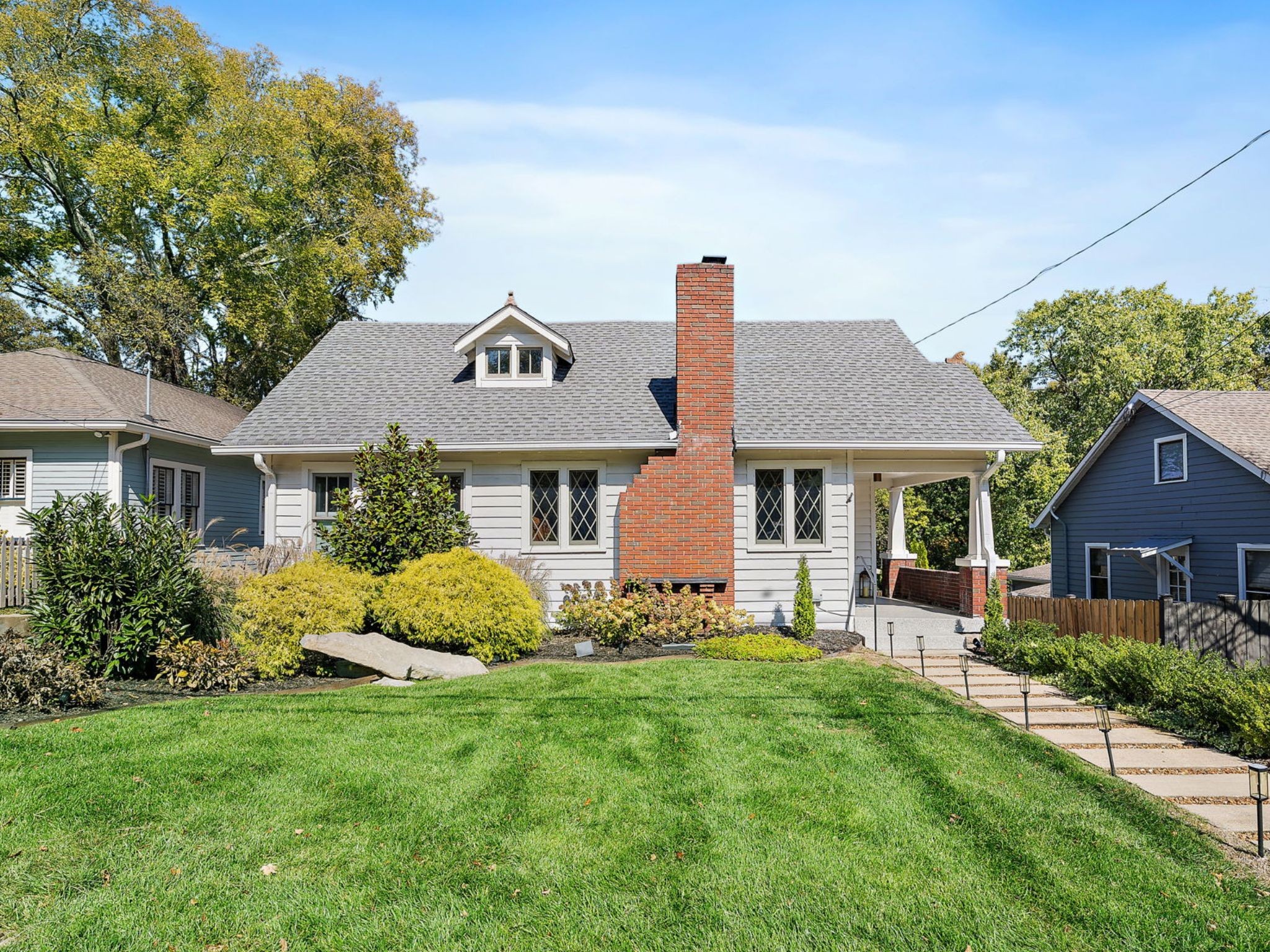 a front view of a house with garden