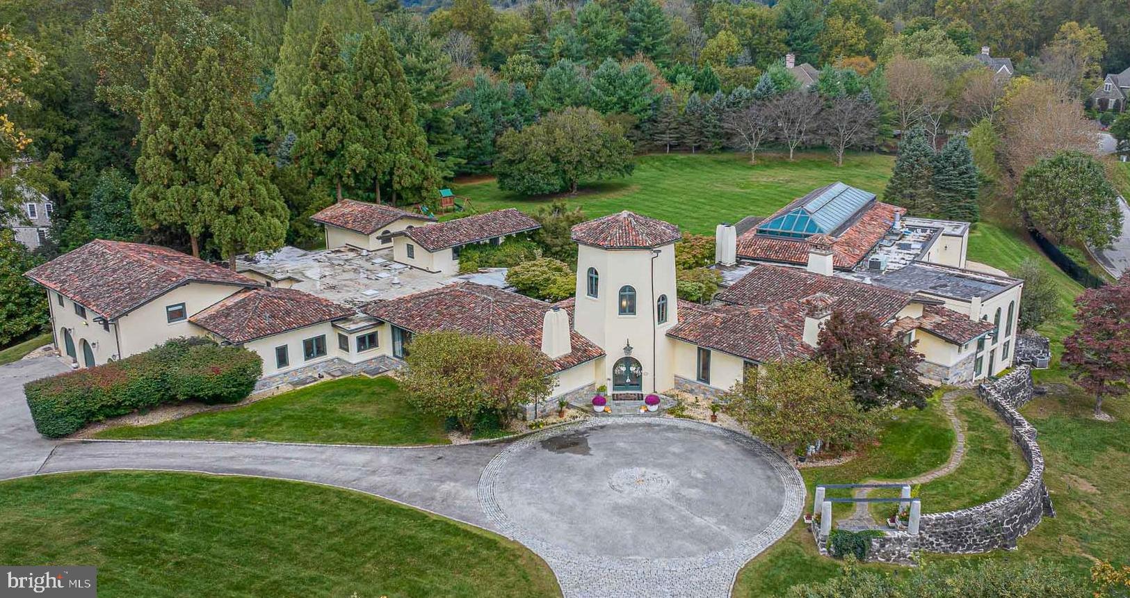 an aerial view of a house with outdoor space