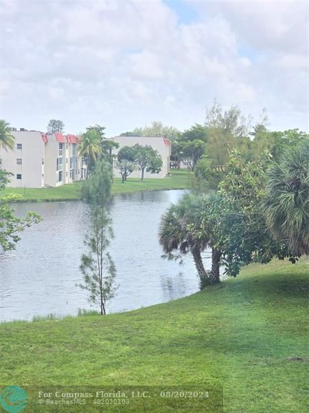 a view of a lake with a house in the background