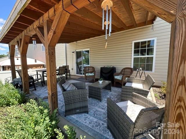 a view of a patio with couches and potted plants