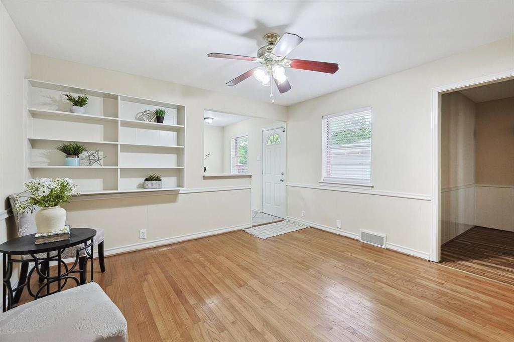 a living room with stainless steel appliances kitchen island granite countertop furniture and a window