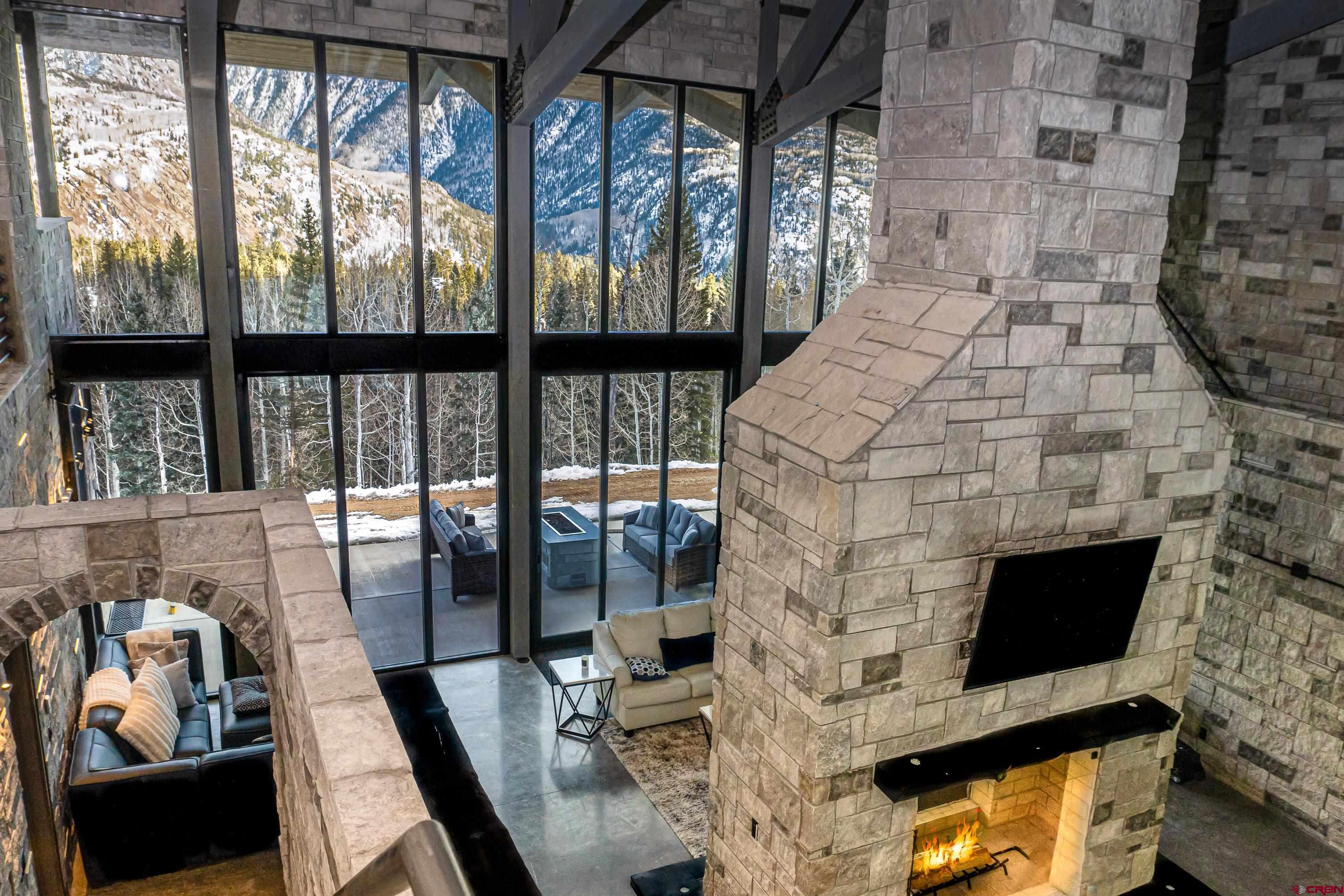 a living room with fireplace furniture and a flat screen tv