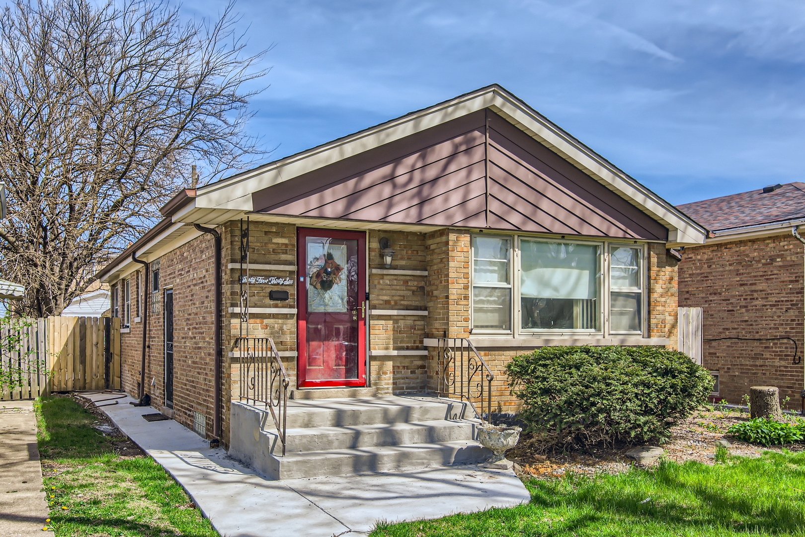 front view of a house with a yard