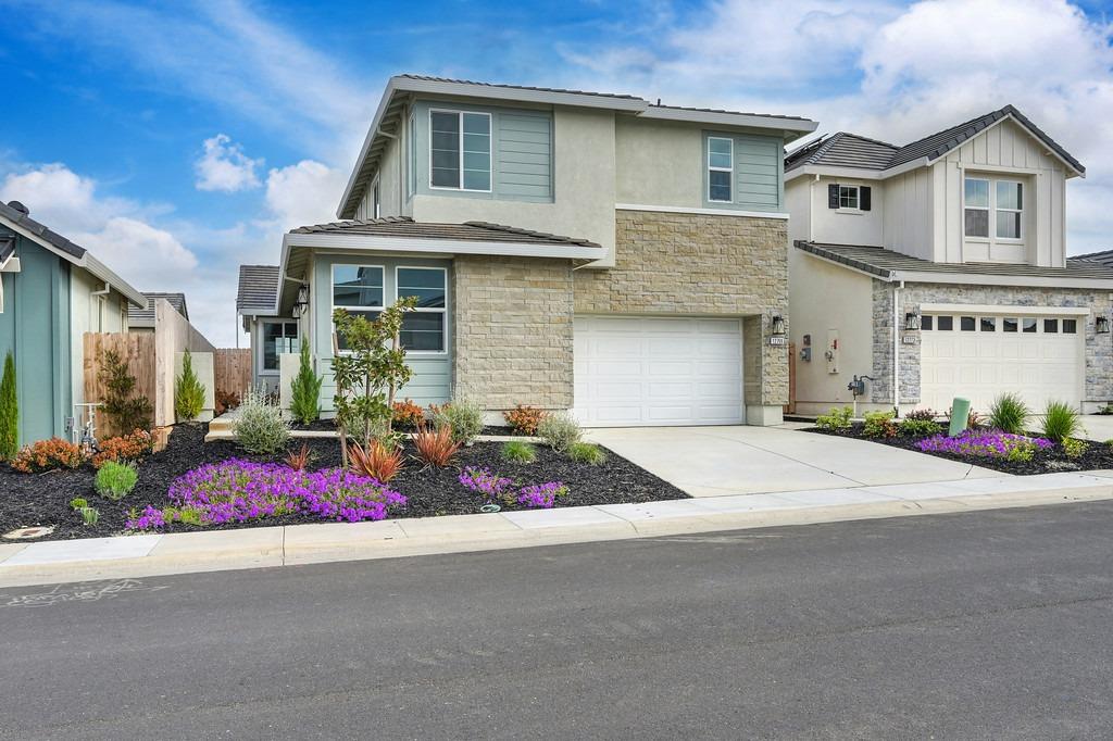 a front view of house with garage