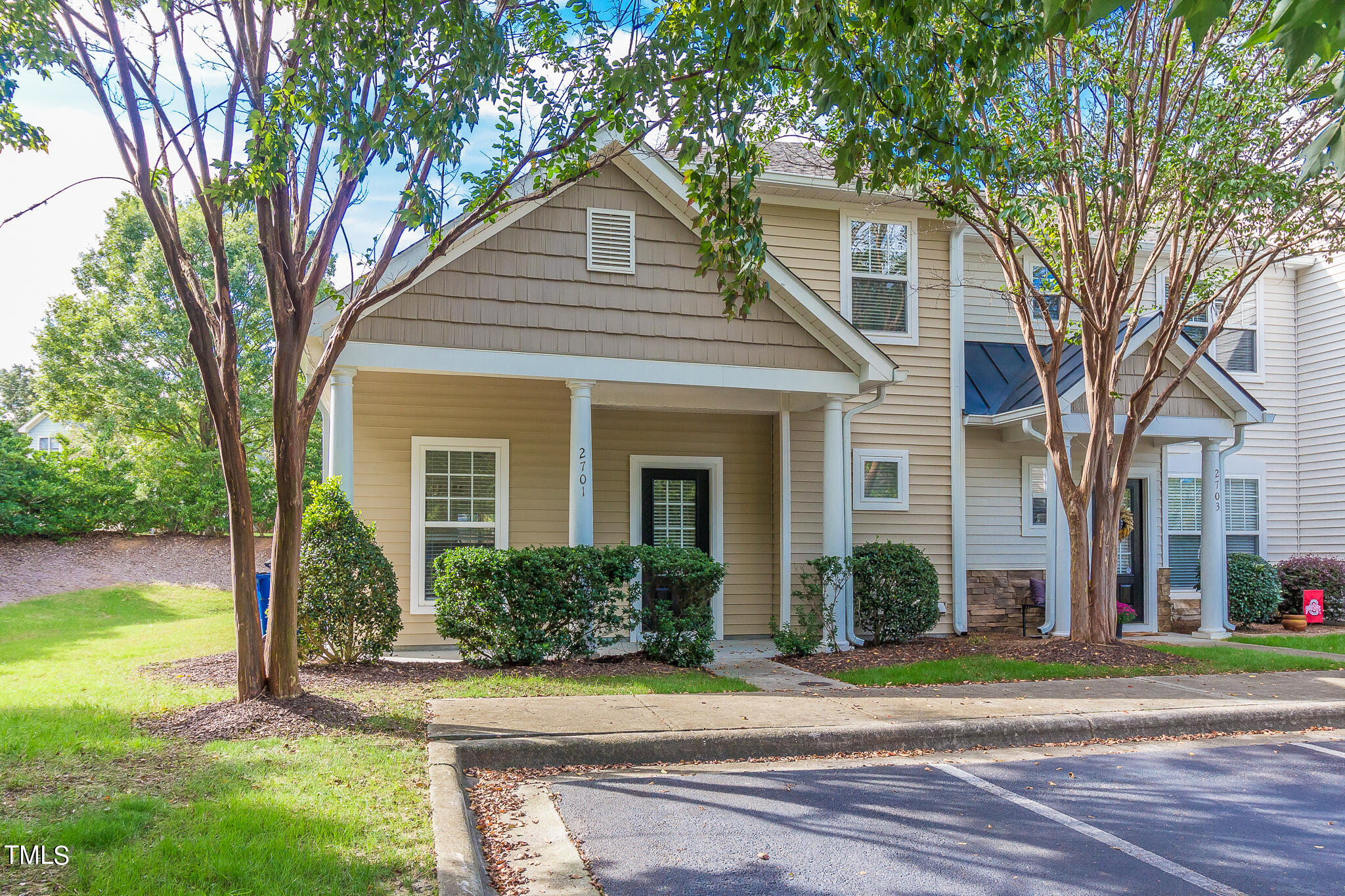 front view of a house with a yard