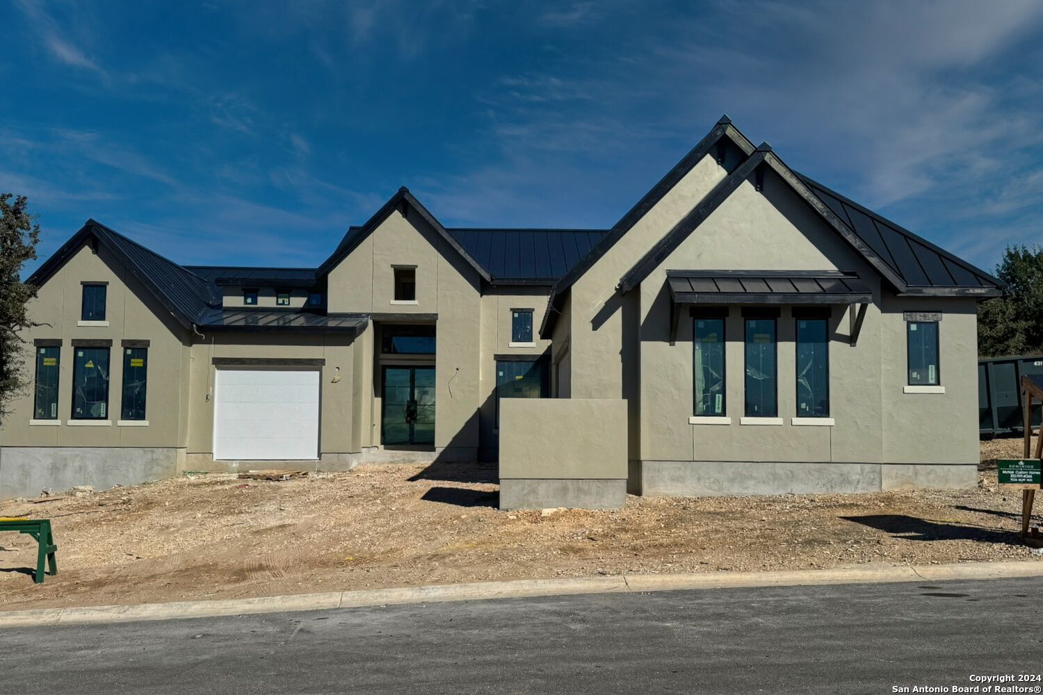 a front view of a house with garage