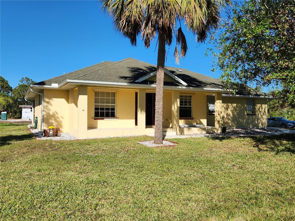 a front view of a house with swimming pool and porch