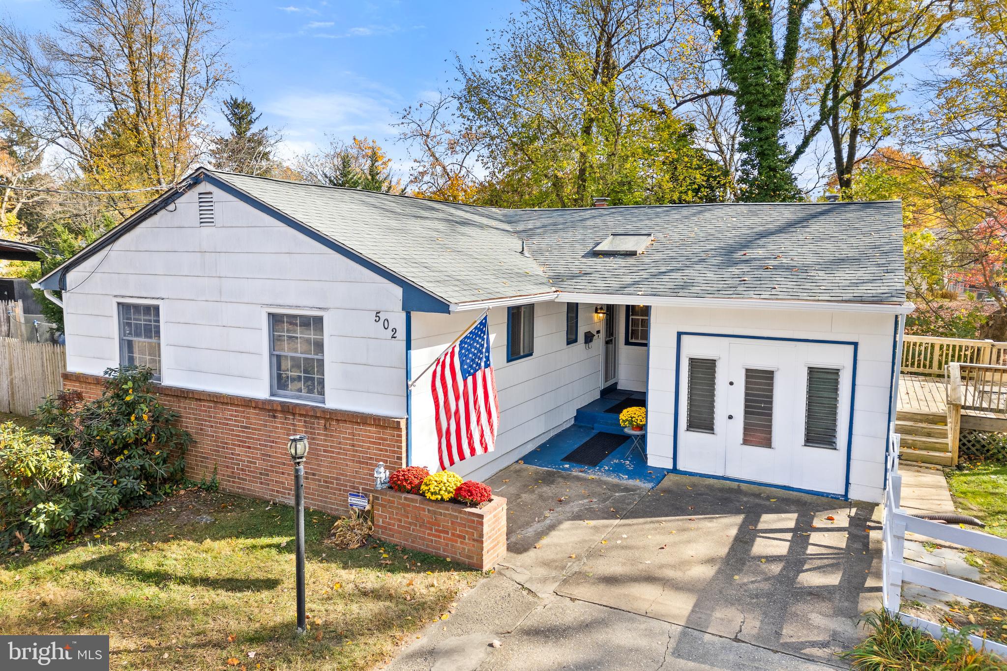 a front view of house with deck and entertaining space