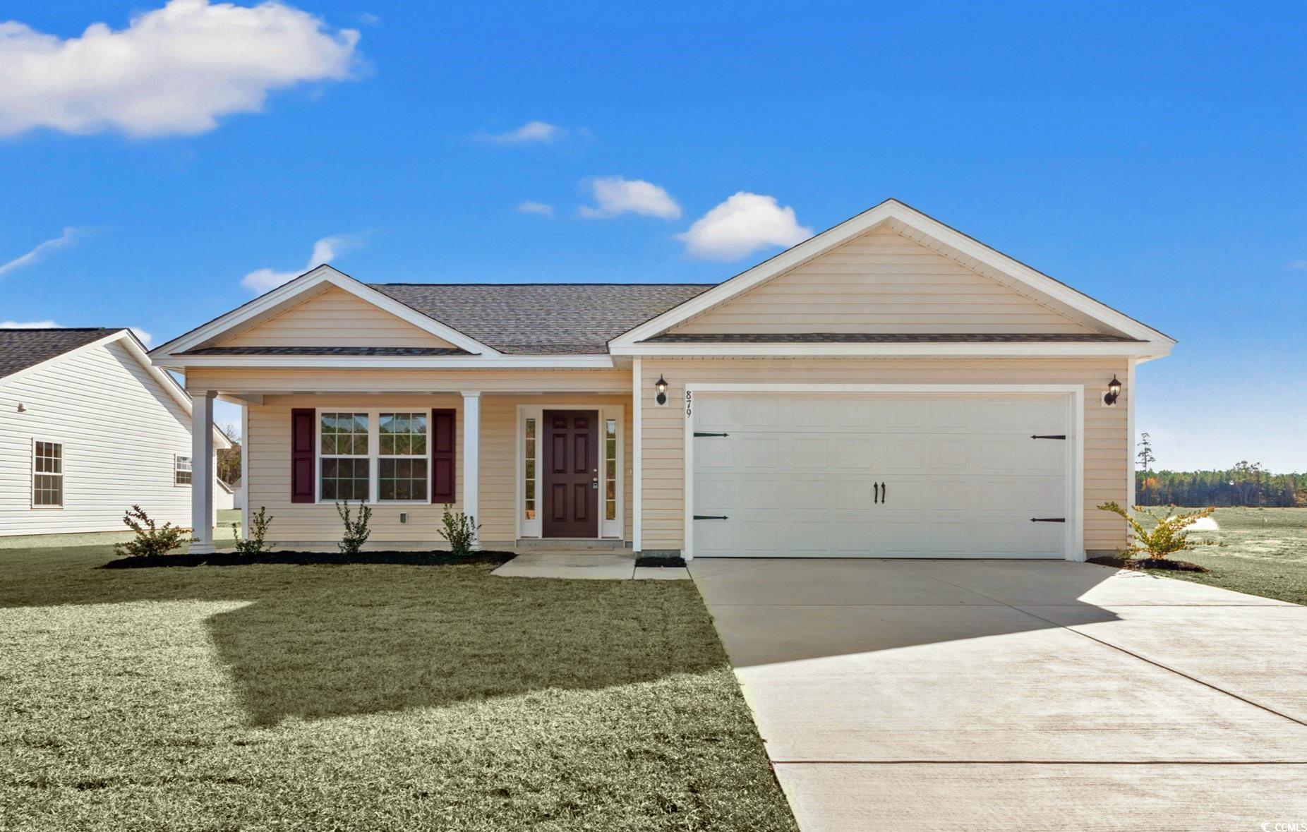 Ranch-style home featuring a garage and a front la