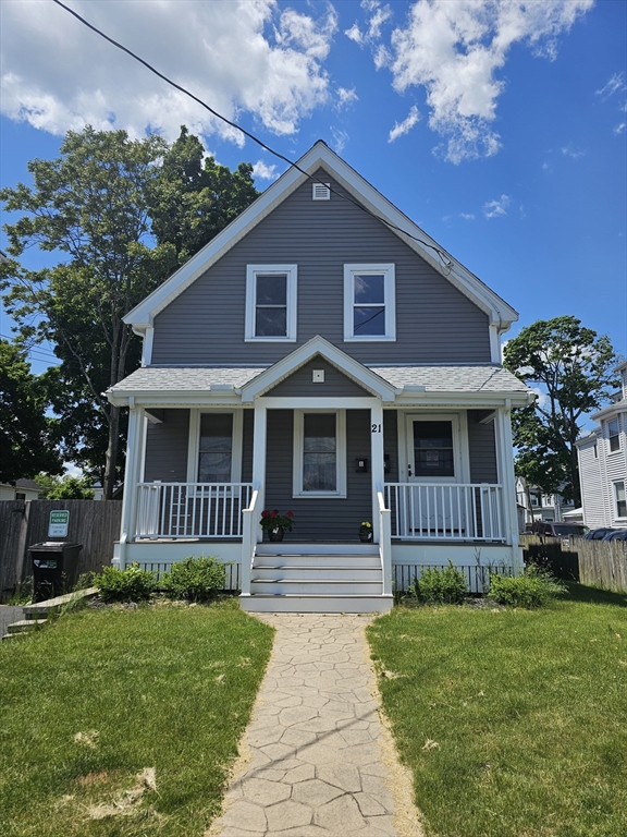 a front view of a house with a garden