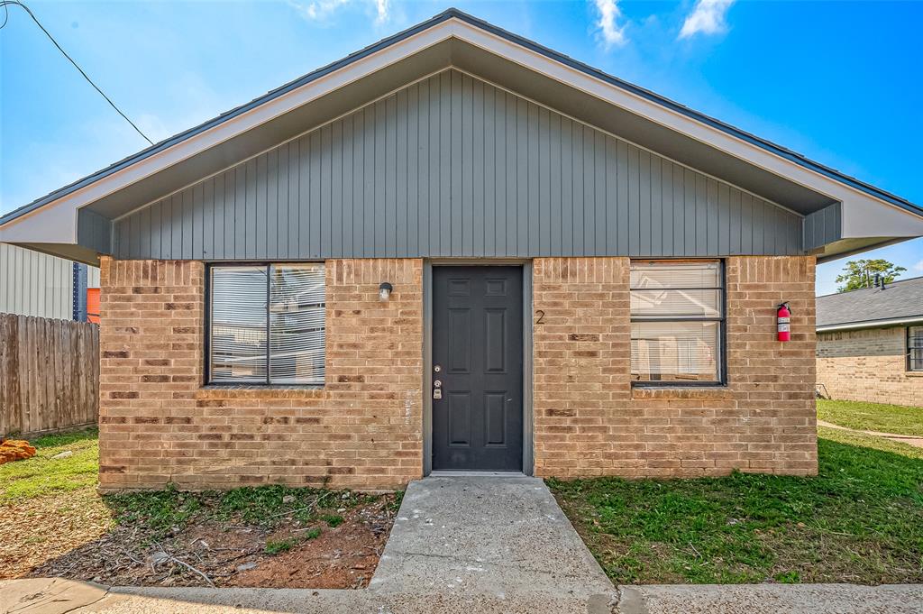 a front view of a house with garage