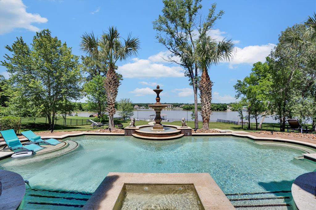 a view of a backyard with swimming pool