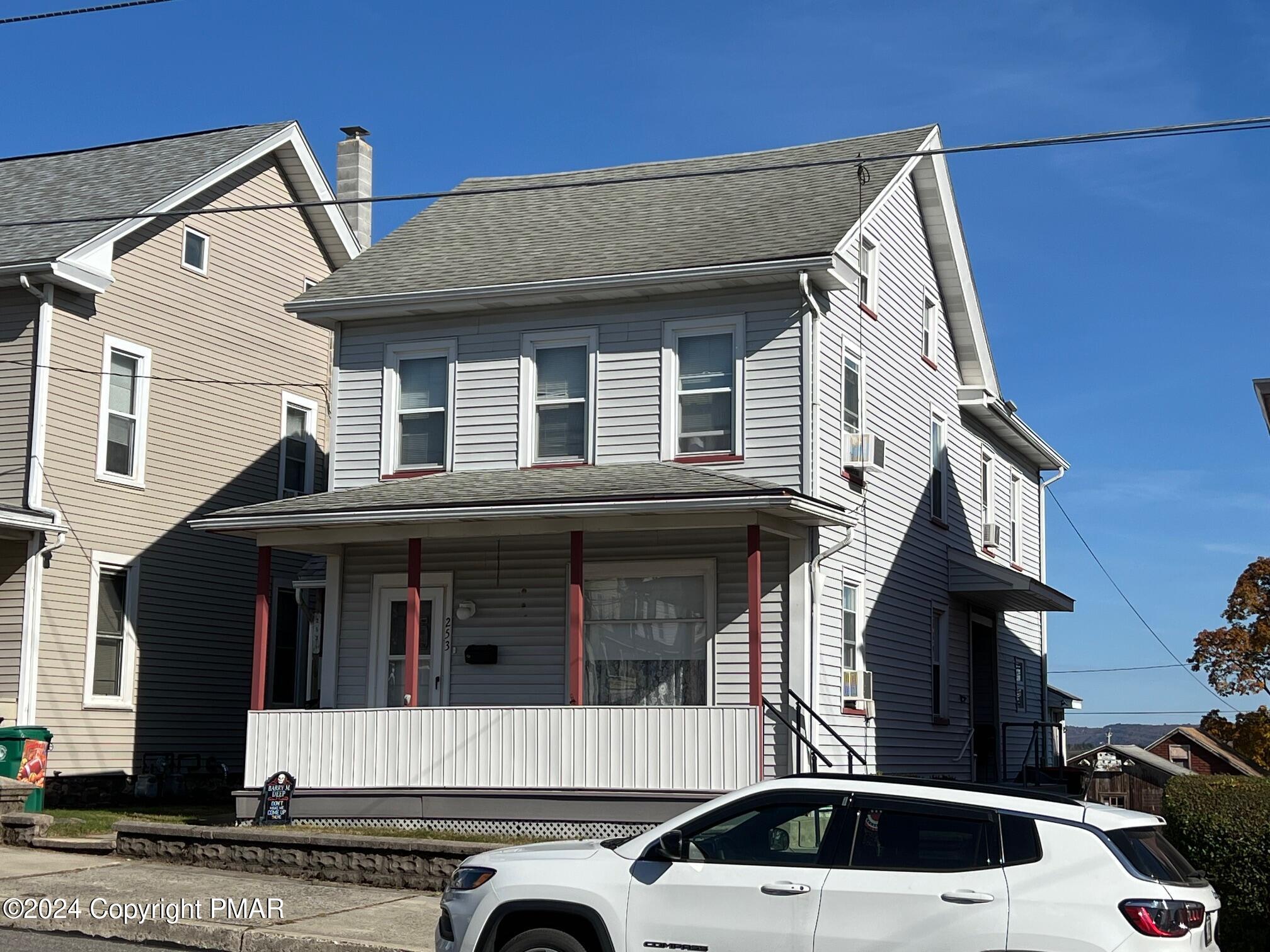 a front view of a house with a garage