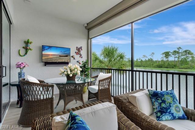 Partially Staged Lanai with wide lake view and preserves