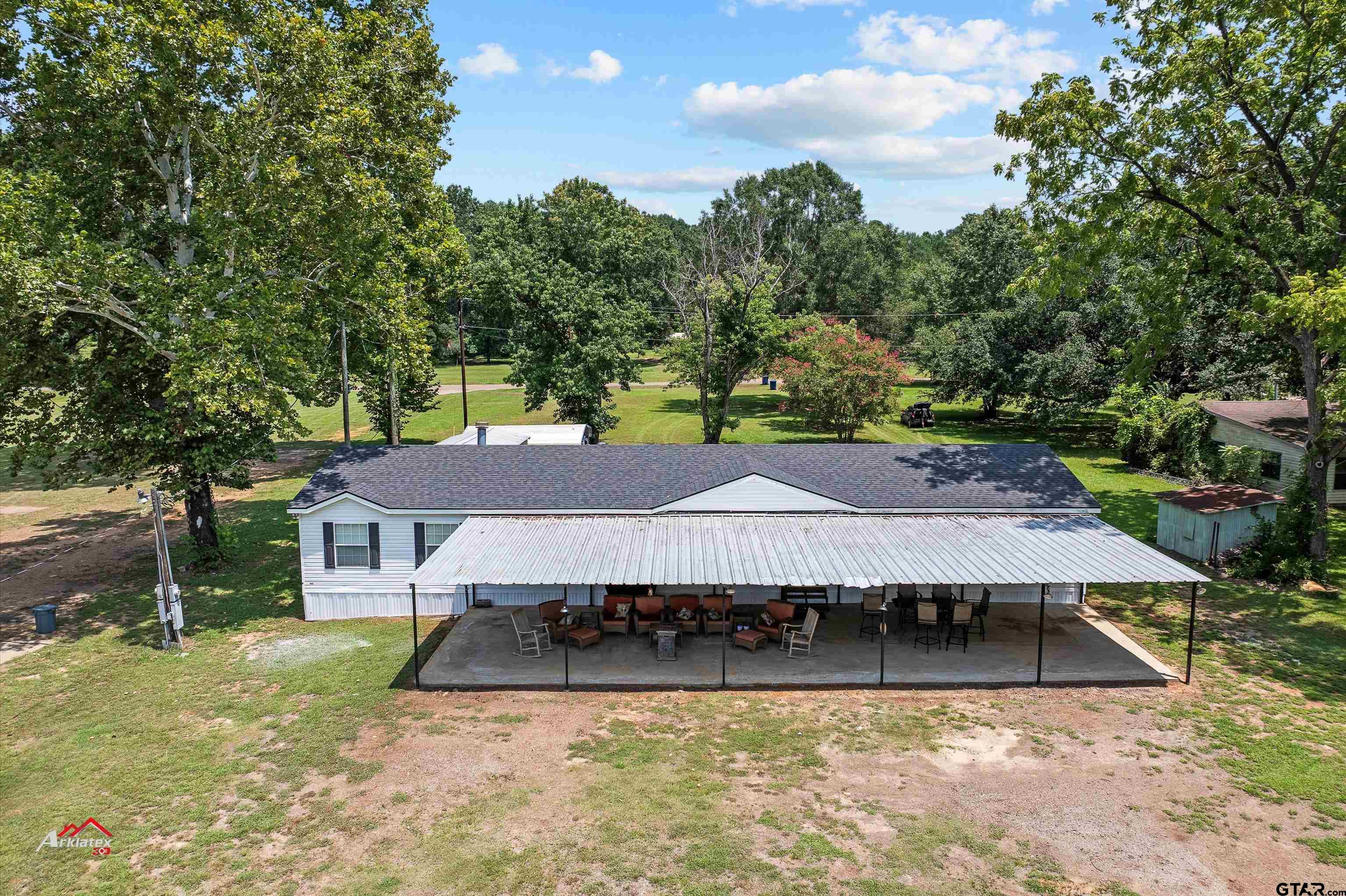 an aerial view of a house with a swimming pool