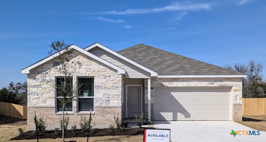 a view of house with garage