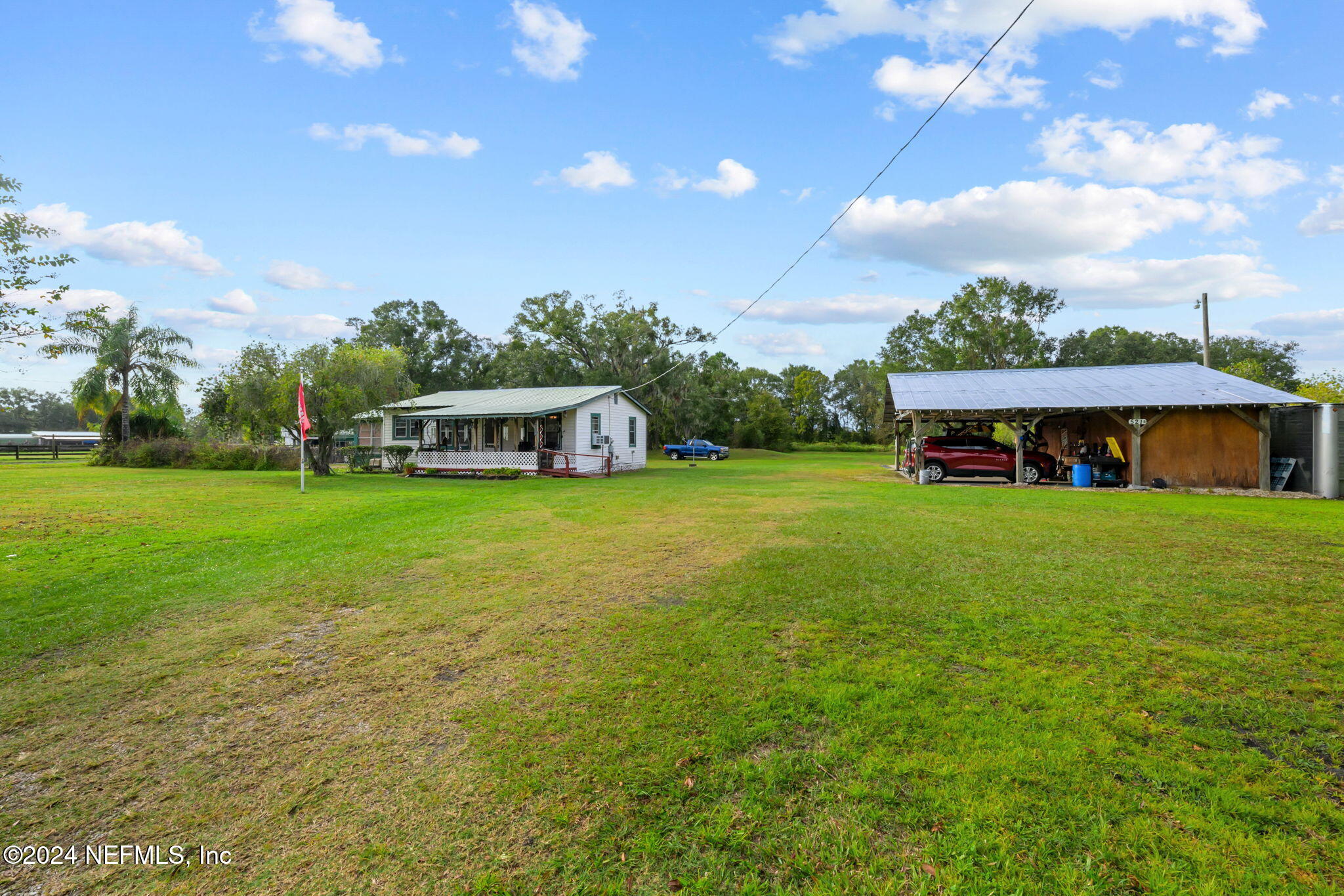 a view of a house with a big yard