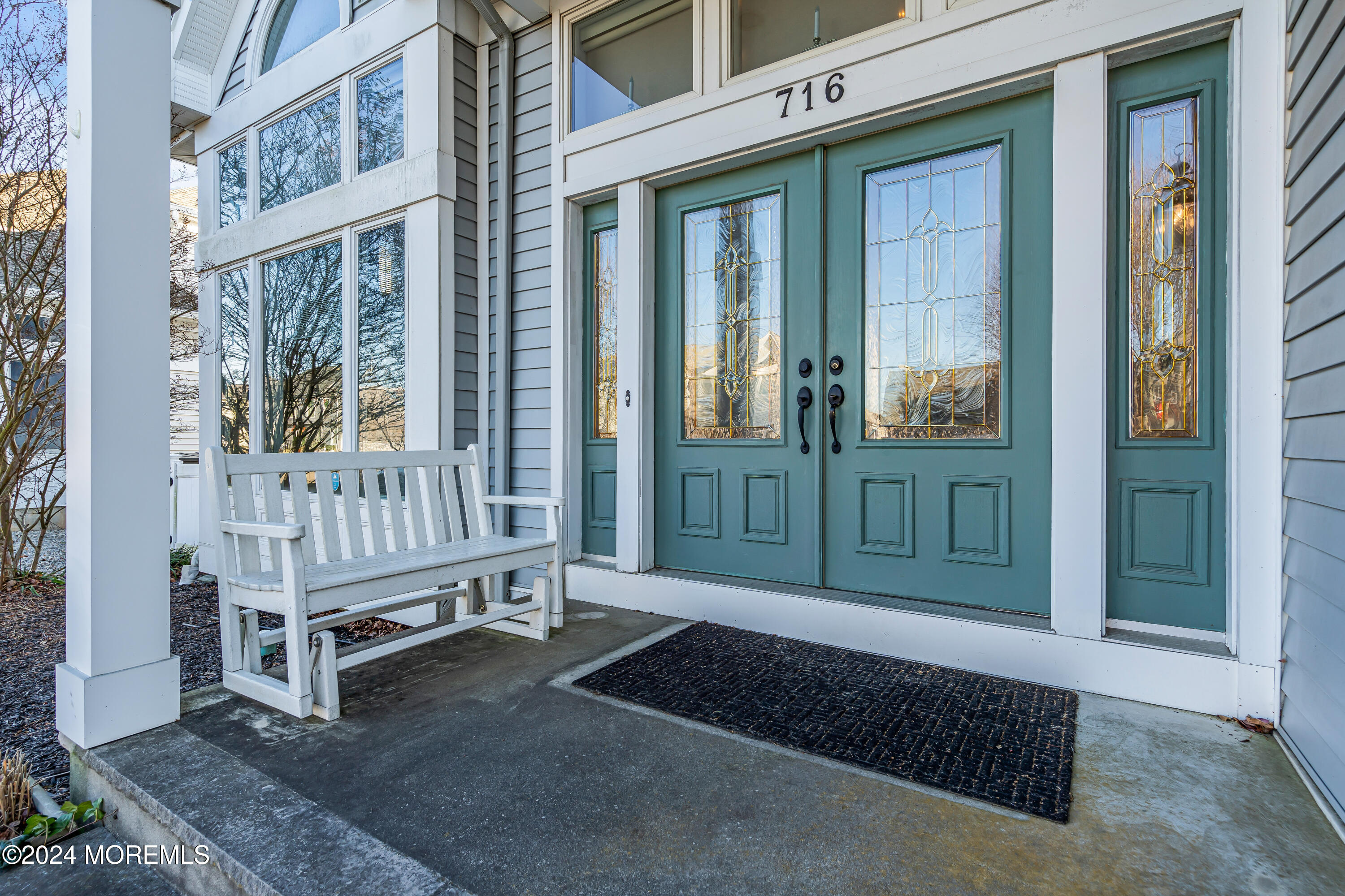 a view of a house with porch and wooden floor