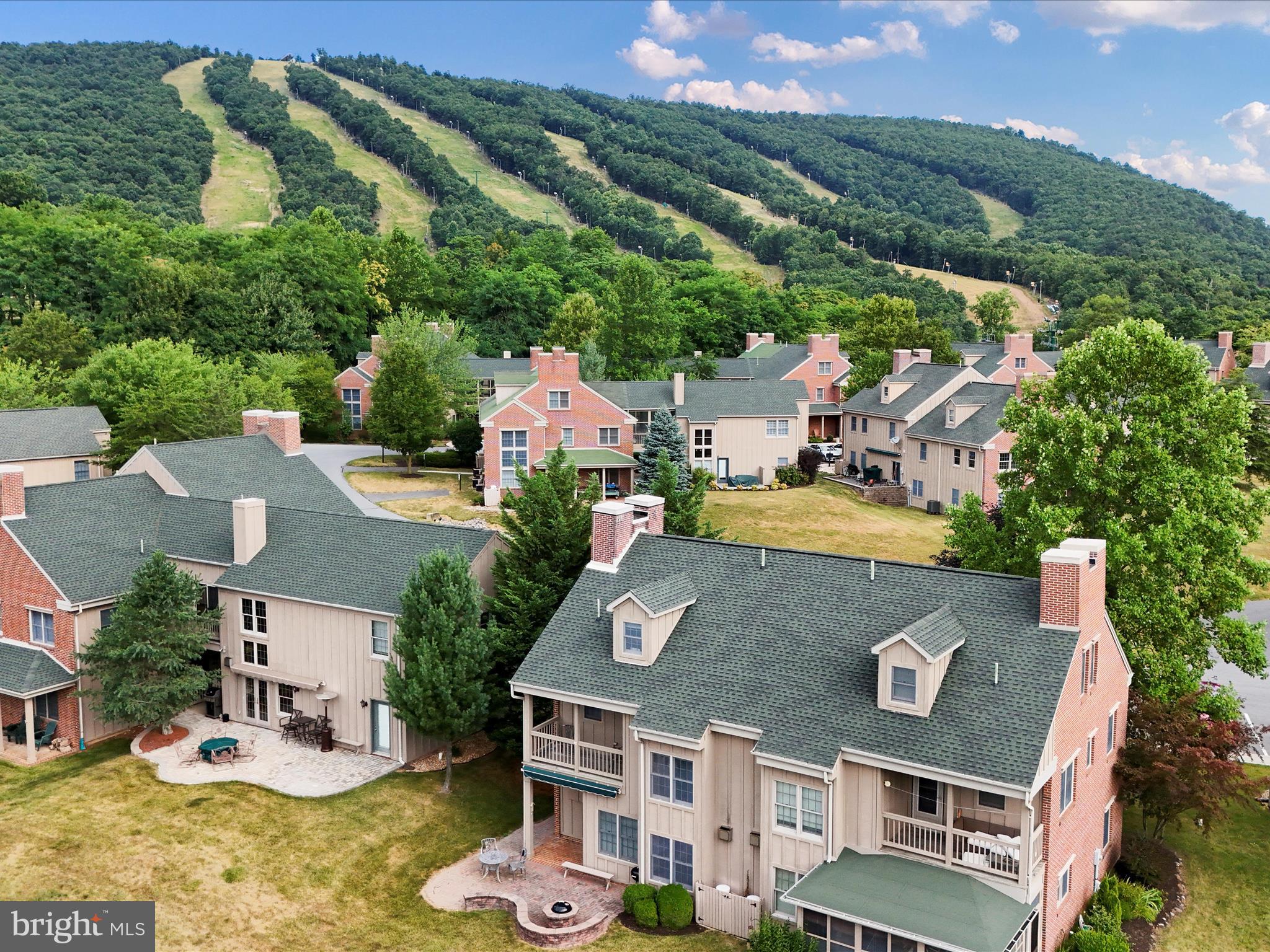 an aerial view of residential house with outdoor space and swimming pool