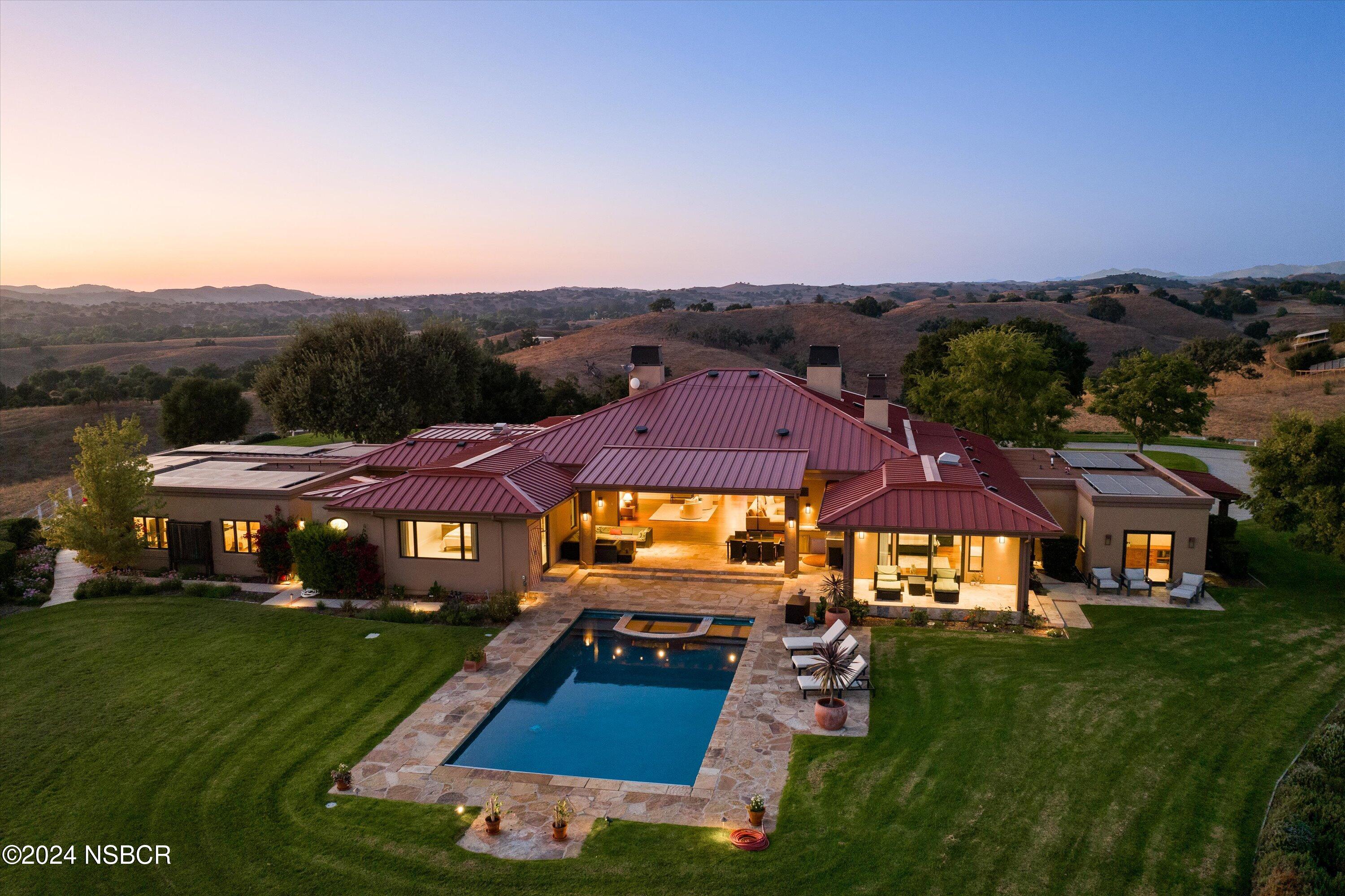 an aerial view of residential houses and outdoor space