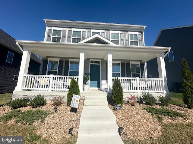 a front view of a house with a porch