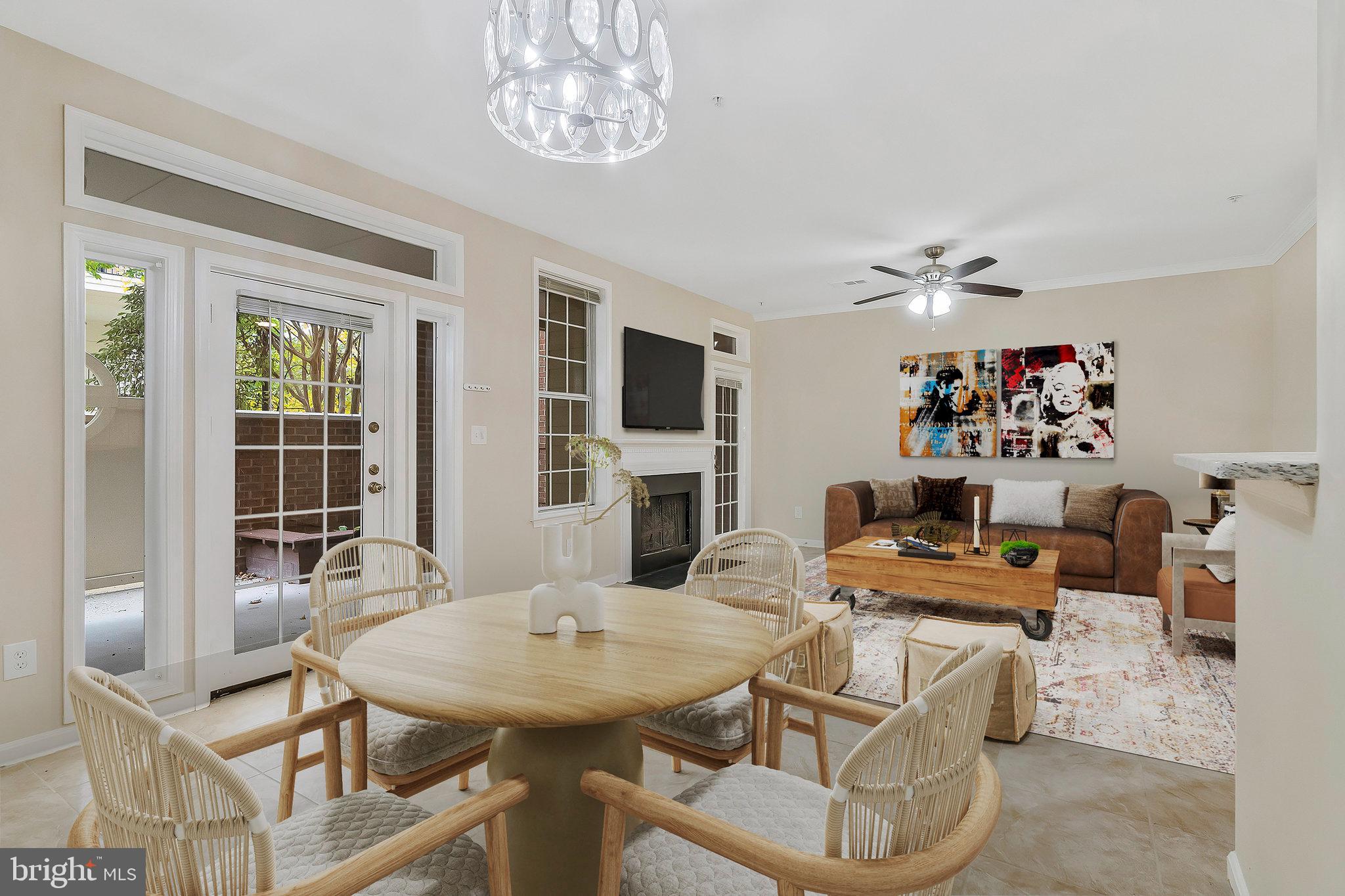 a view of a dining room with furniture and a chandelier